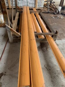 logs coated with flatline, showing consistent finish